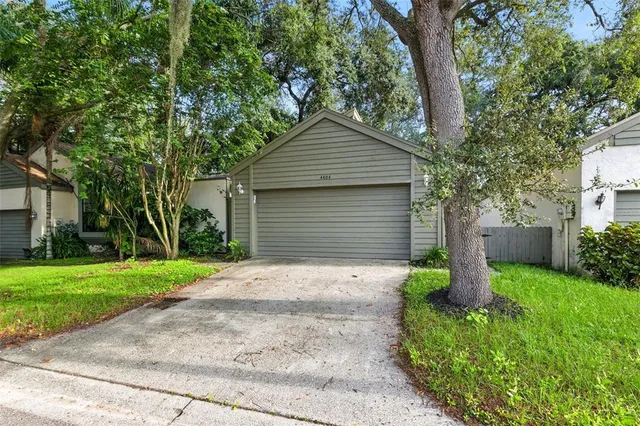 a small hut with trees in the background