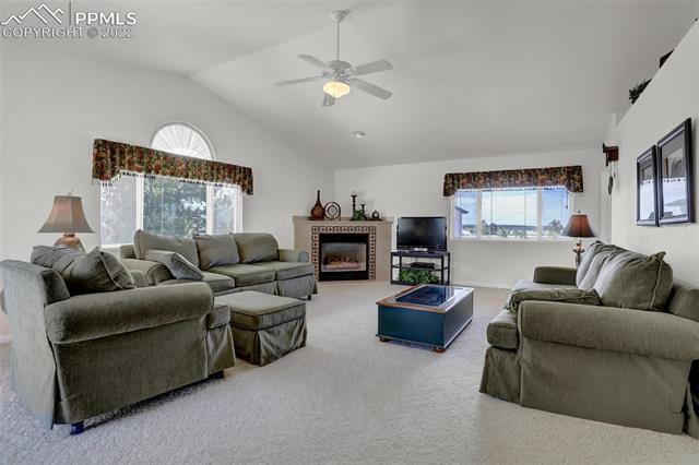 12425 Old Barn Road Elbert, CO 80106 - Photo 5 of 36 Great room with vaulted ceilings and gas fireplace!