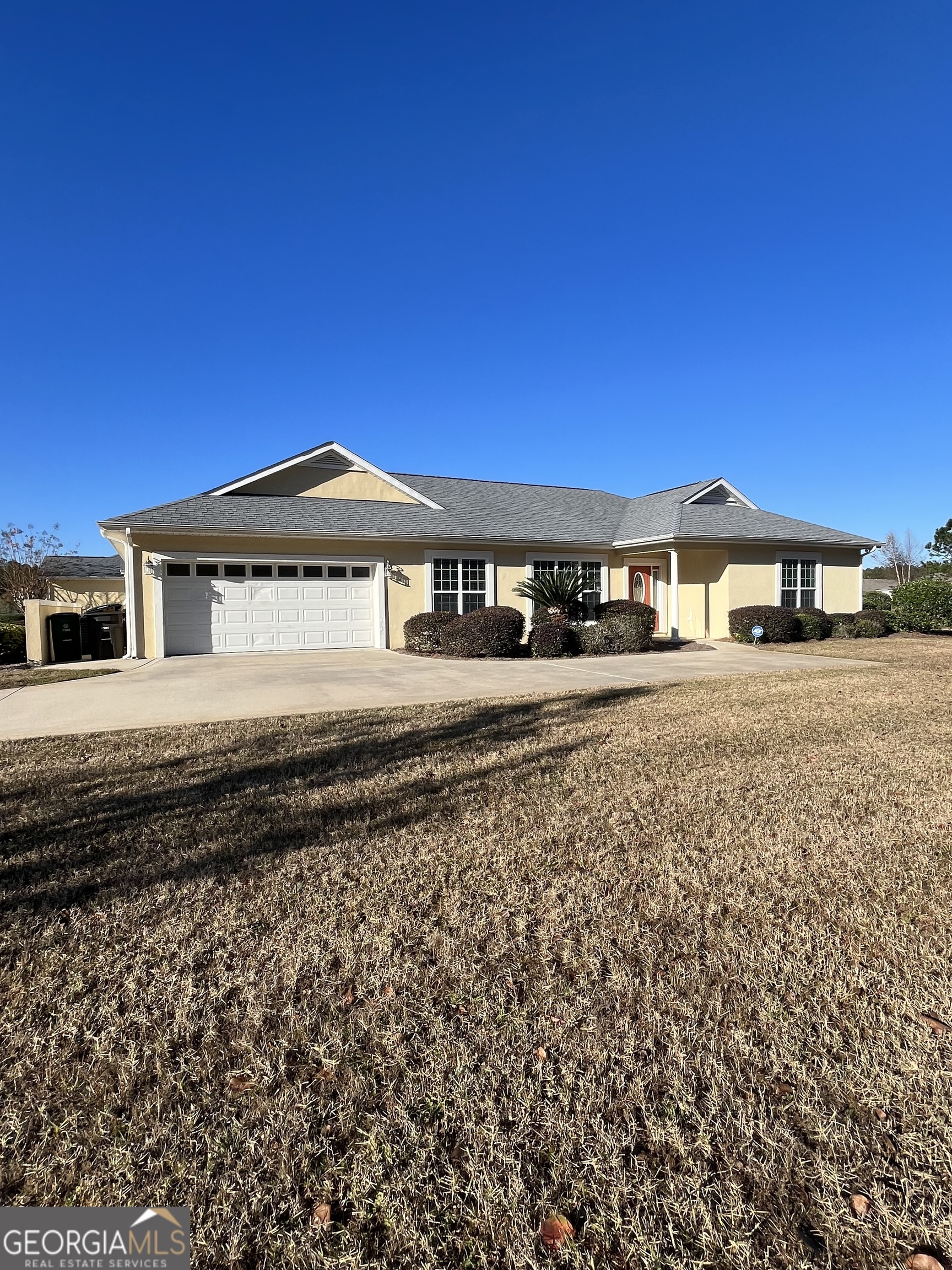 49 Coastal Walk St. Marys, GA 31558 - Photo 1 of 42 a front view of a house with a yard