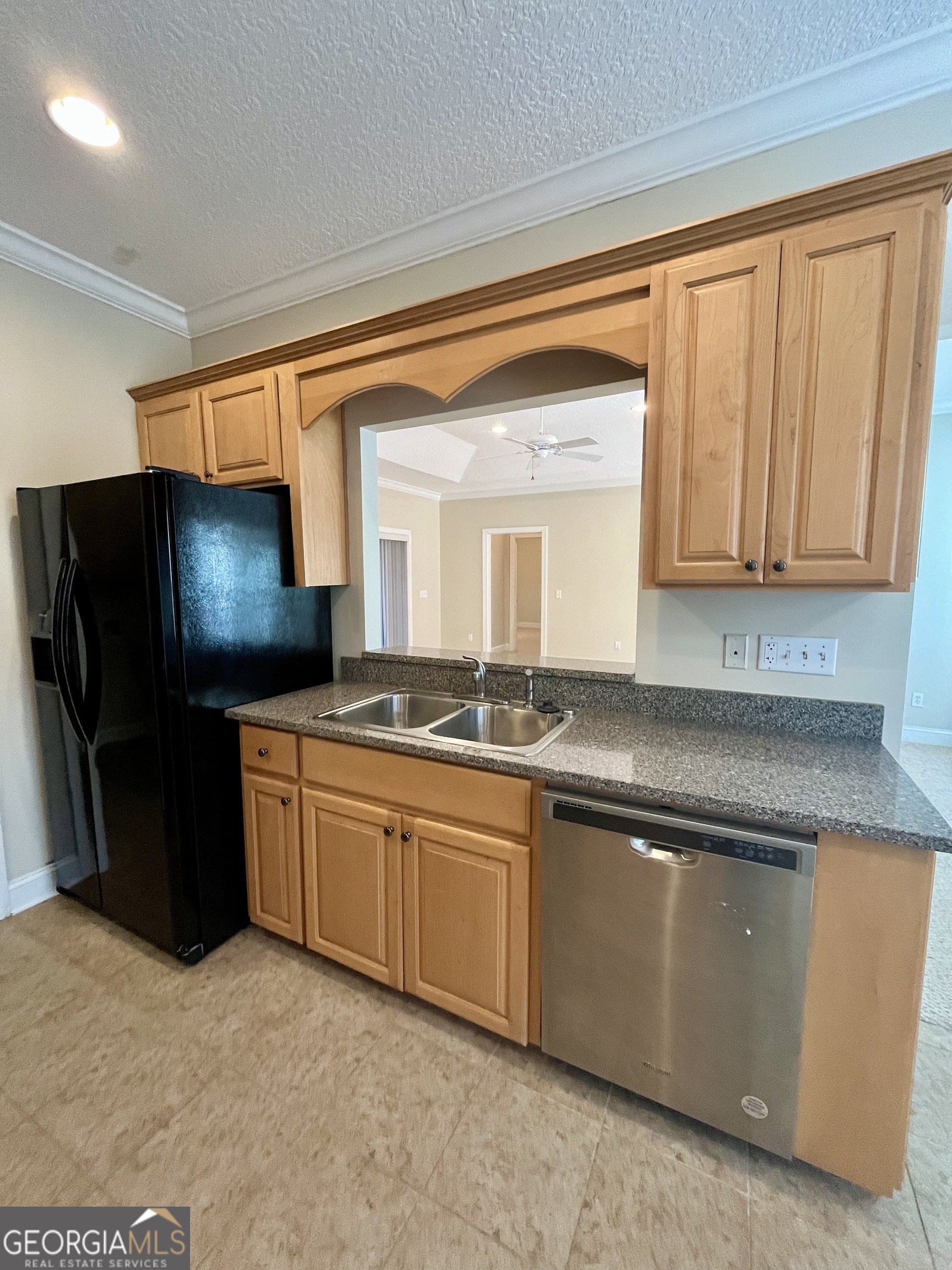 49 Coastal Walk St. Marys, GA 31558 - Photo 14 of 42 a kitchen with stainless steel appliances granite countertop a refrigerator and a stove