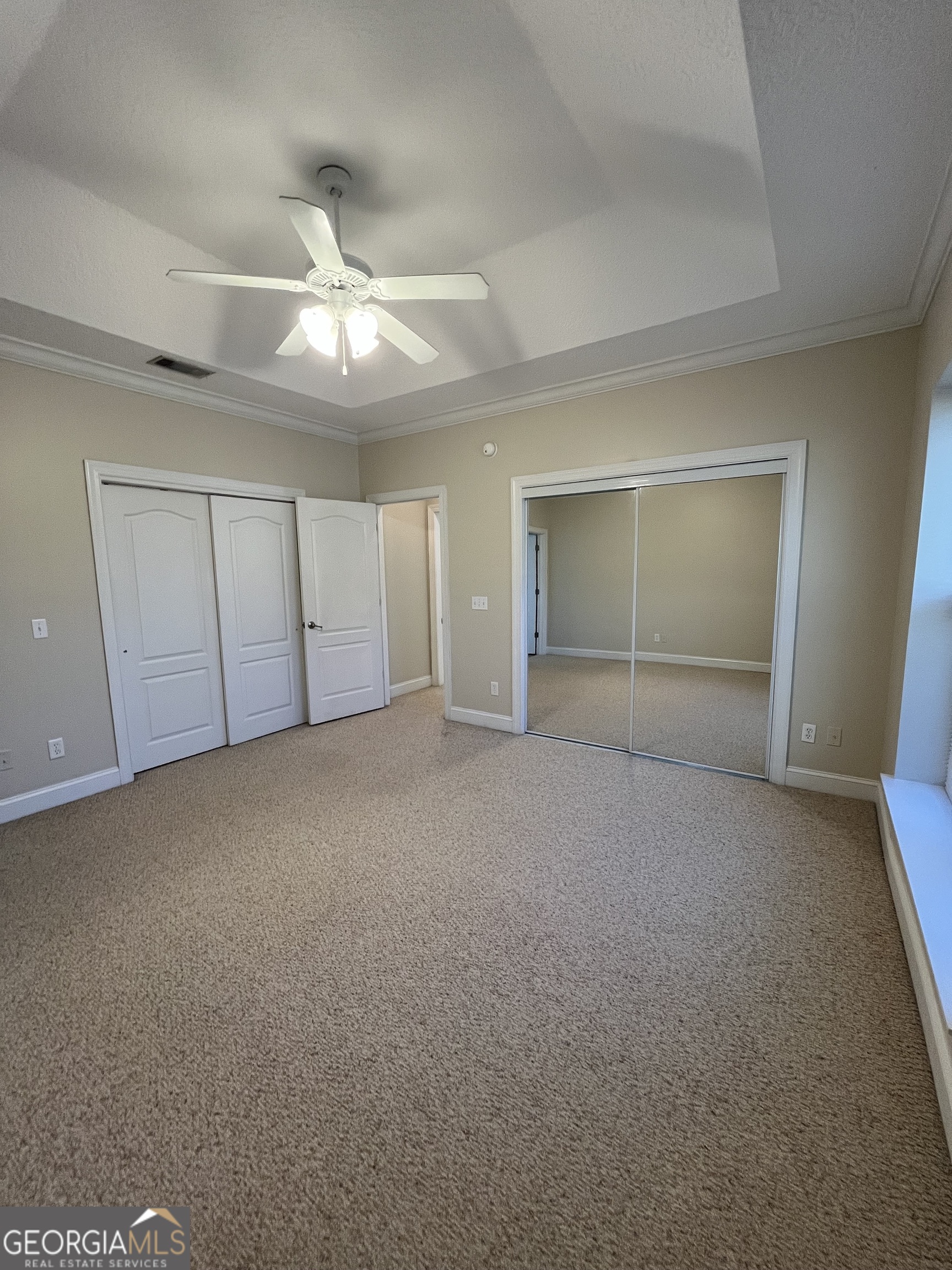 49 Coastal Walk St. Marys, GA 31558 - Photo 26 of 42 a view of an empty room with a ceiling fan and window