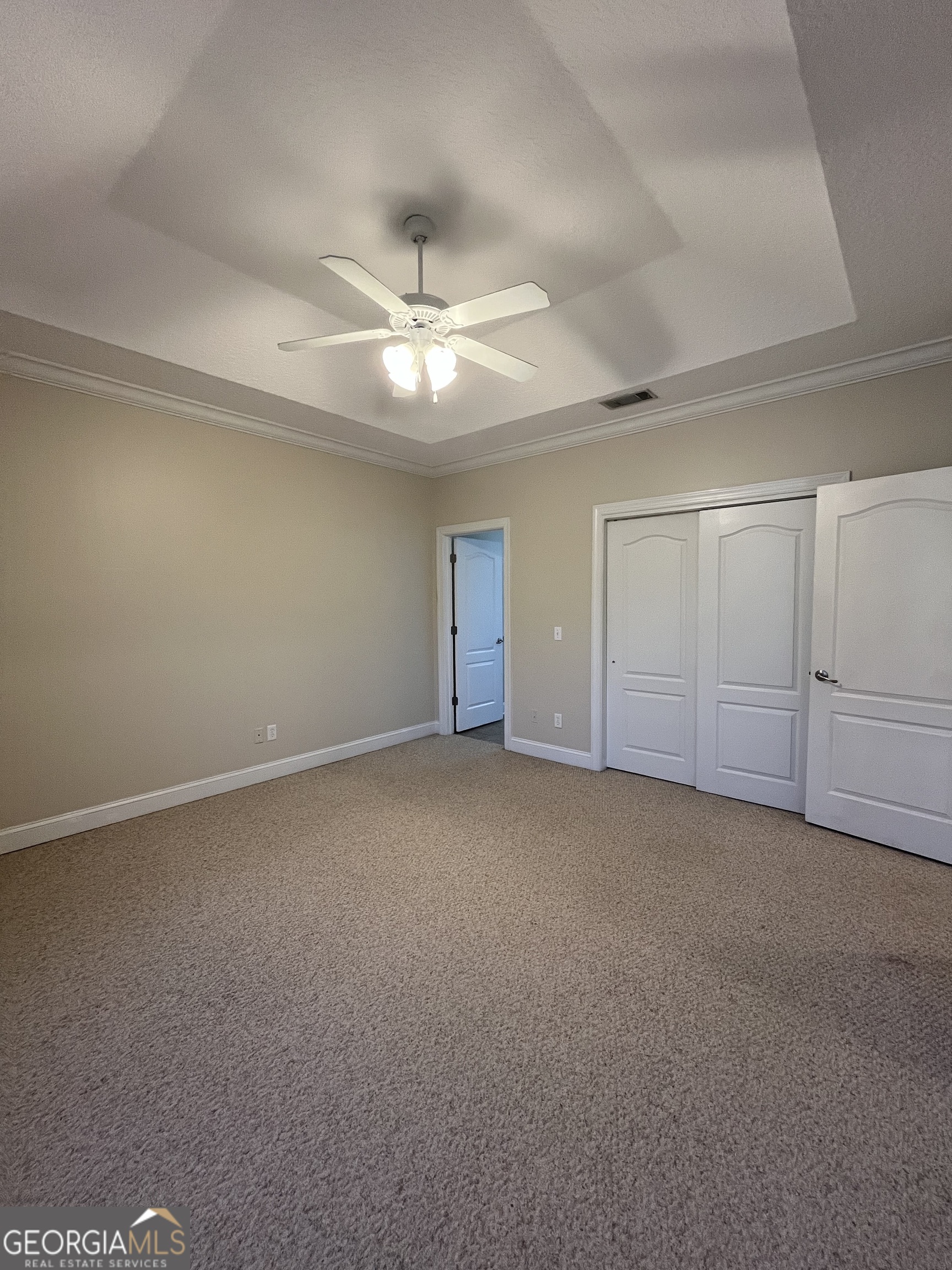 49 Coastal Walk St. Marys, GA 31558 - Photo 27 of 42 a view of an empty room with a ceiling fan
