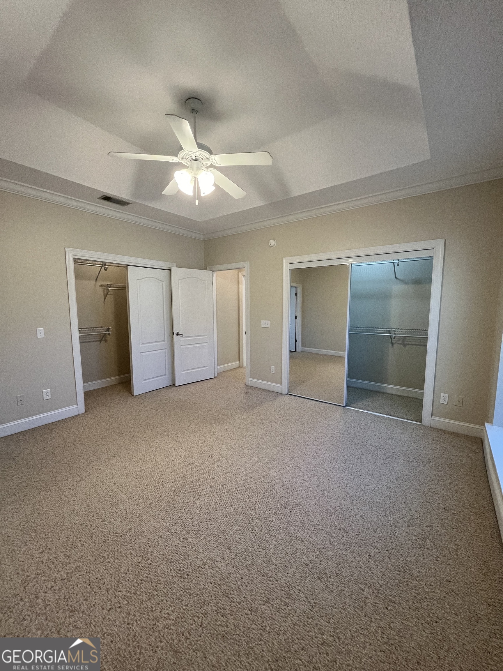 49 Coastal Walk St. Marys, GA 31558 - Photo 28 of 42 a view of an empty room with a ceiling fan