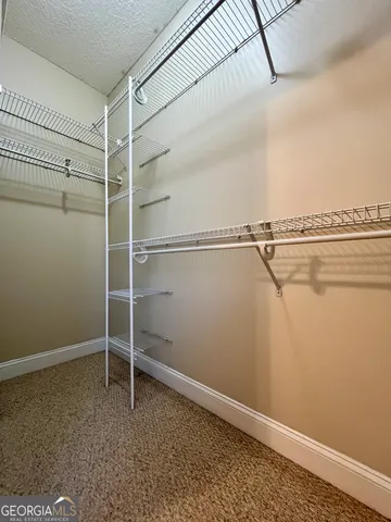 a view of a room with racks on the wall