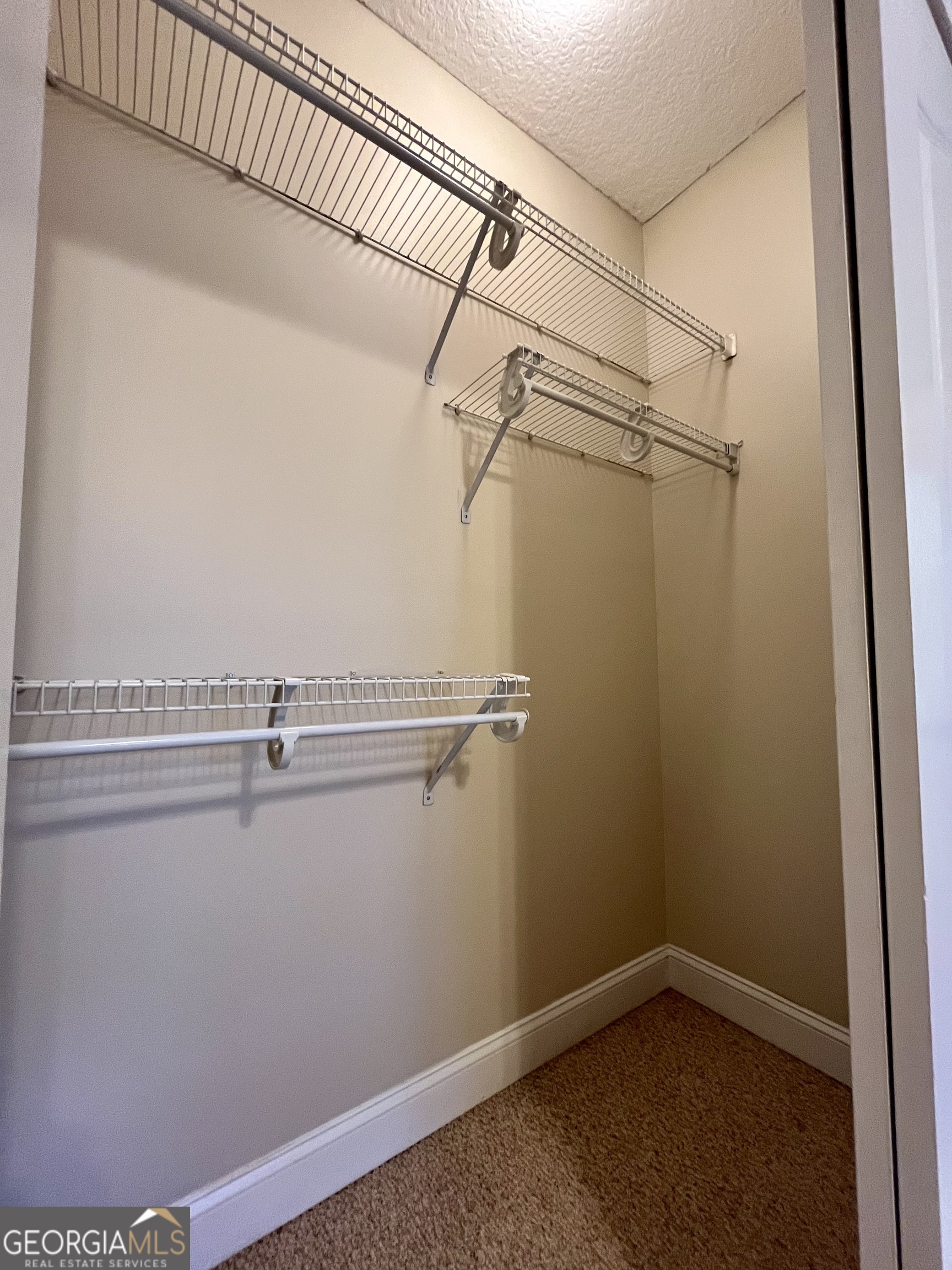 49 Coastal Walk St. Marys, GA 31558 - Photo 30 of 42 a view of a room with racks on the wall