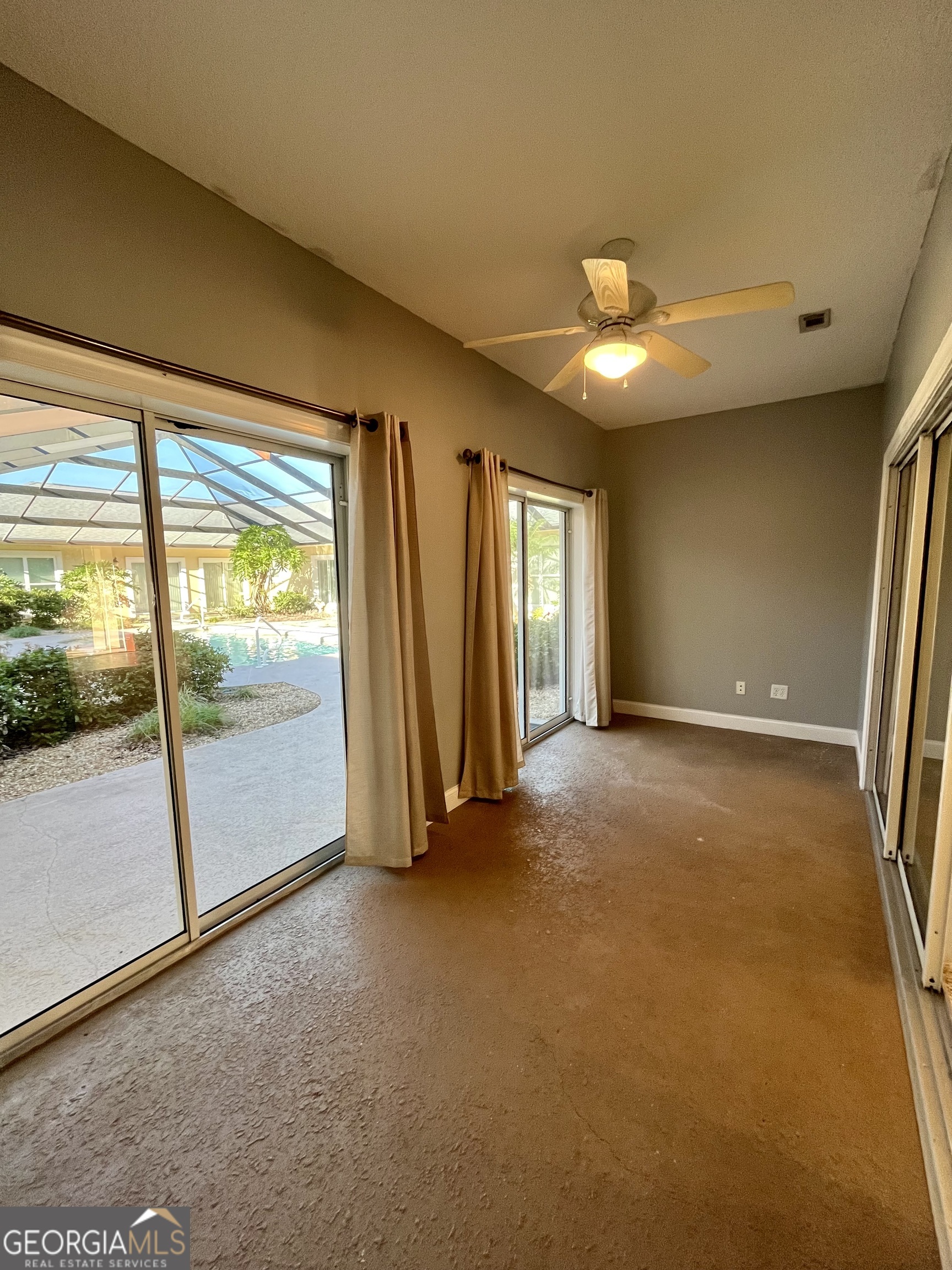 49 Coastal Walk St. Marys, GA 31558 - Photo 37 of 42 an empty room with windows and city view