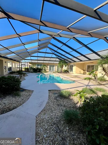 a view of a backyard of the house