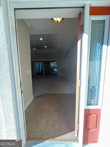 view of a living room with a floor to ceiling window