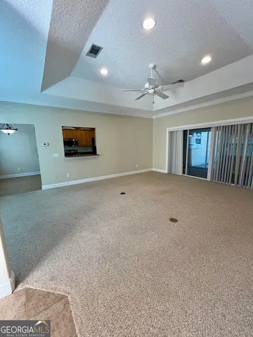 a view of an empty room with windows