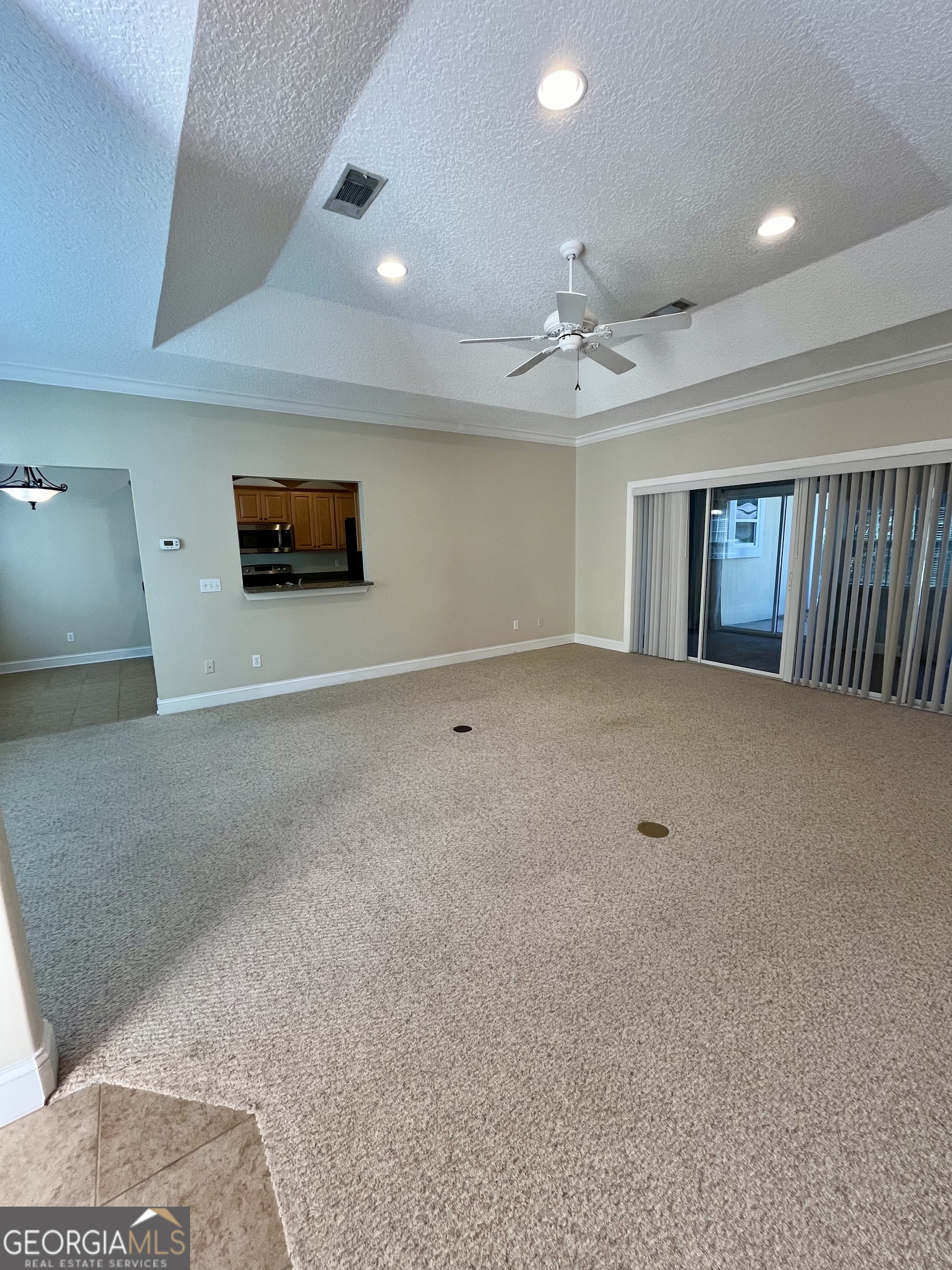 49 Coastal Walk St. Marys, GA 31558 - Photo 8 of 42 a view of an empty room with windows