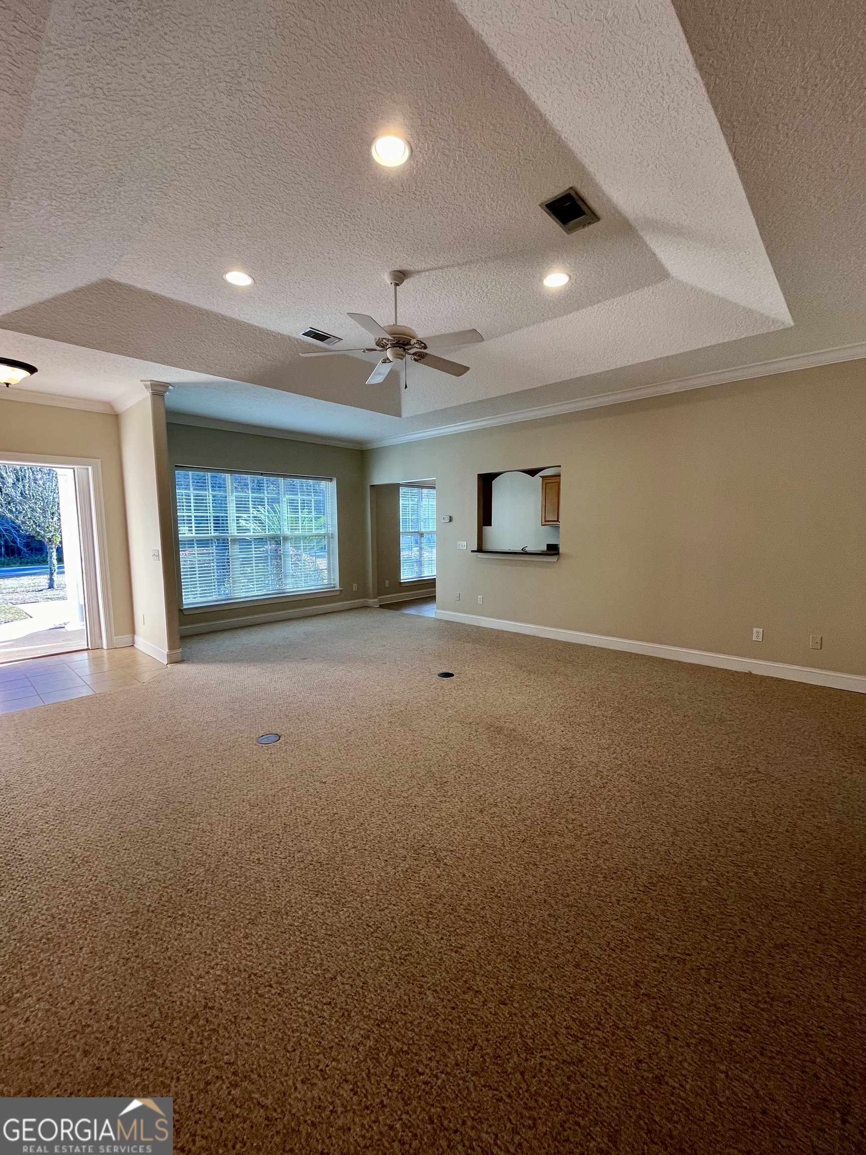 49 Coastal Walk St. Marys, GA 31558 - Photo 9 of 42 an empty room with a empty space and windows