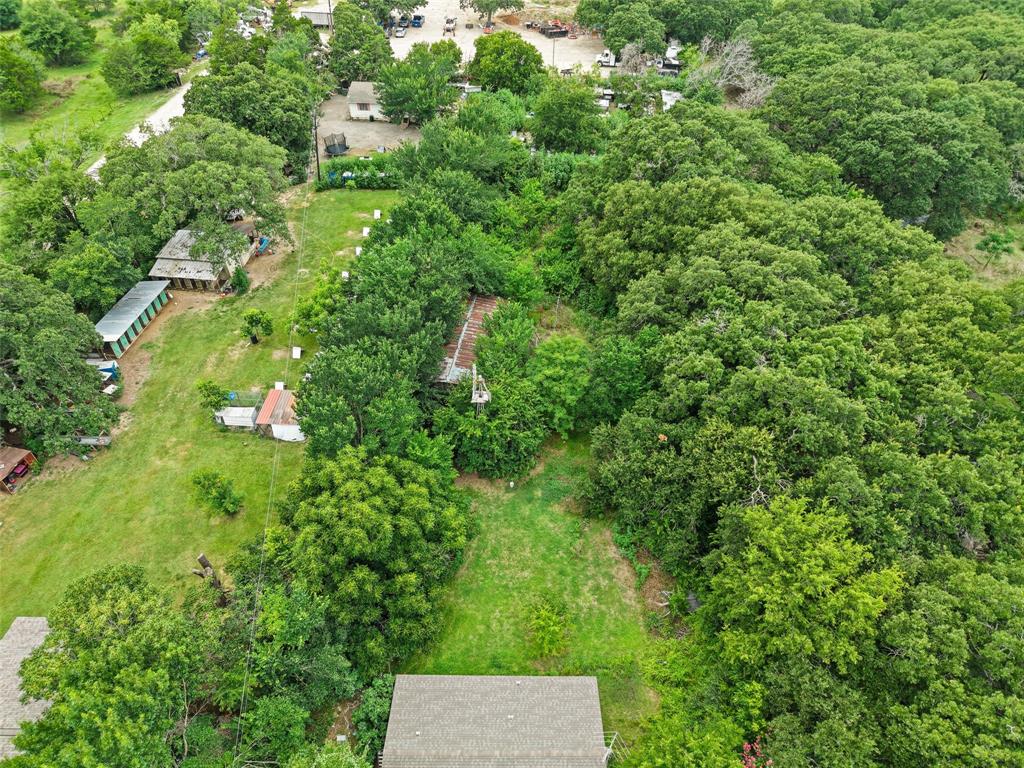 2503 Kleberg Road Seagoville, TX 75159 - Photo 7 of 10 Expansive treed lot featuring a substantial tree canopy and clearings