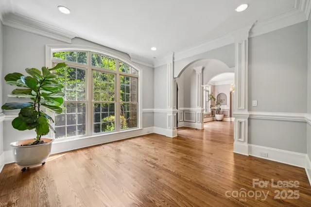a view of an entryway with wooden floor