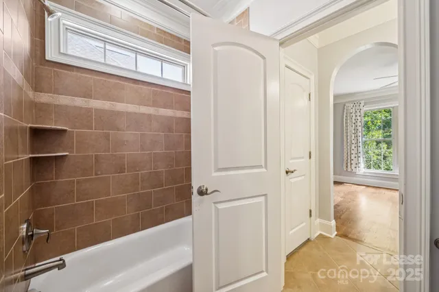 a bathroom with a bathtub and a shower