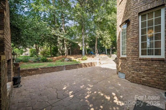 a pathway of a house with a yard