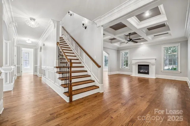 wooden floor in an empty room with a fireplace