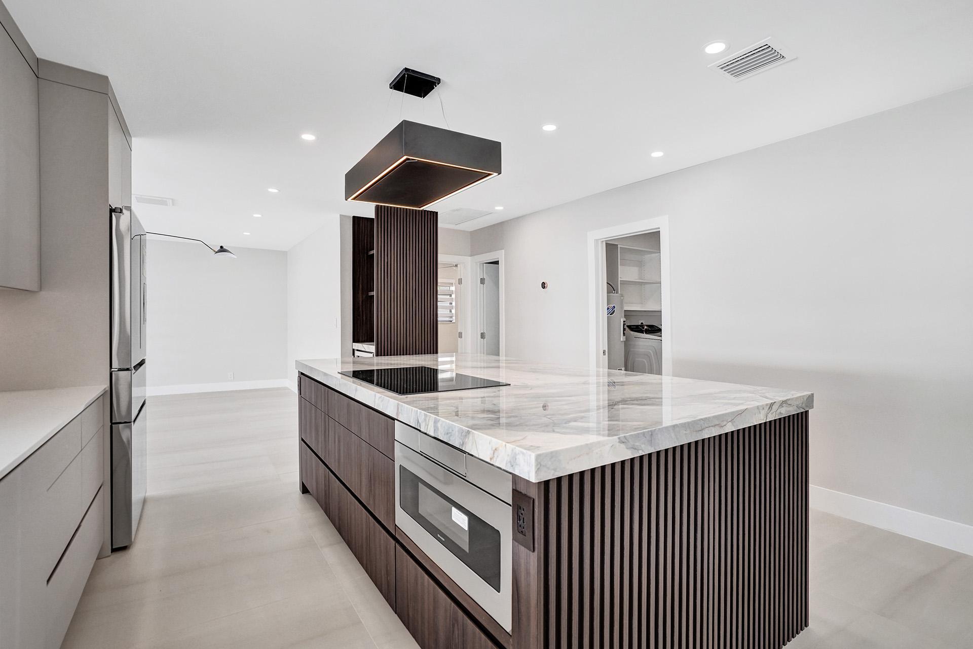 4951 Sarazen Drive Hollywood, FL 33021 - Photo 11 of 21 a kitchen with stainless steel appliances granite countertop a sink and a refrigerator