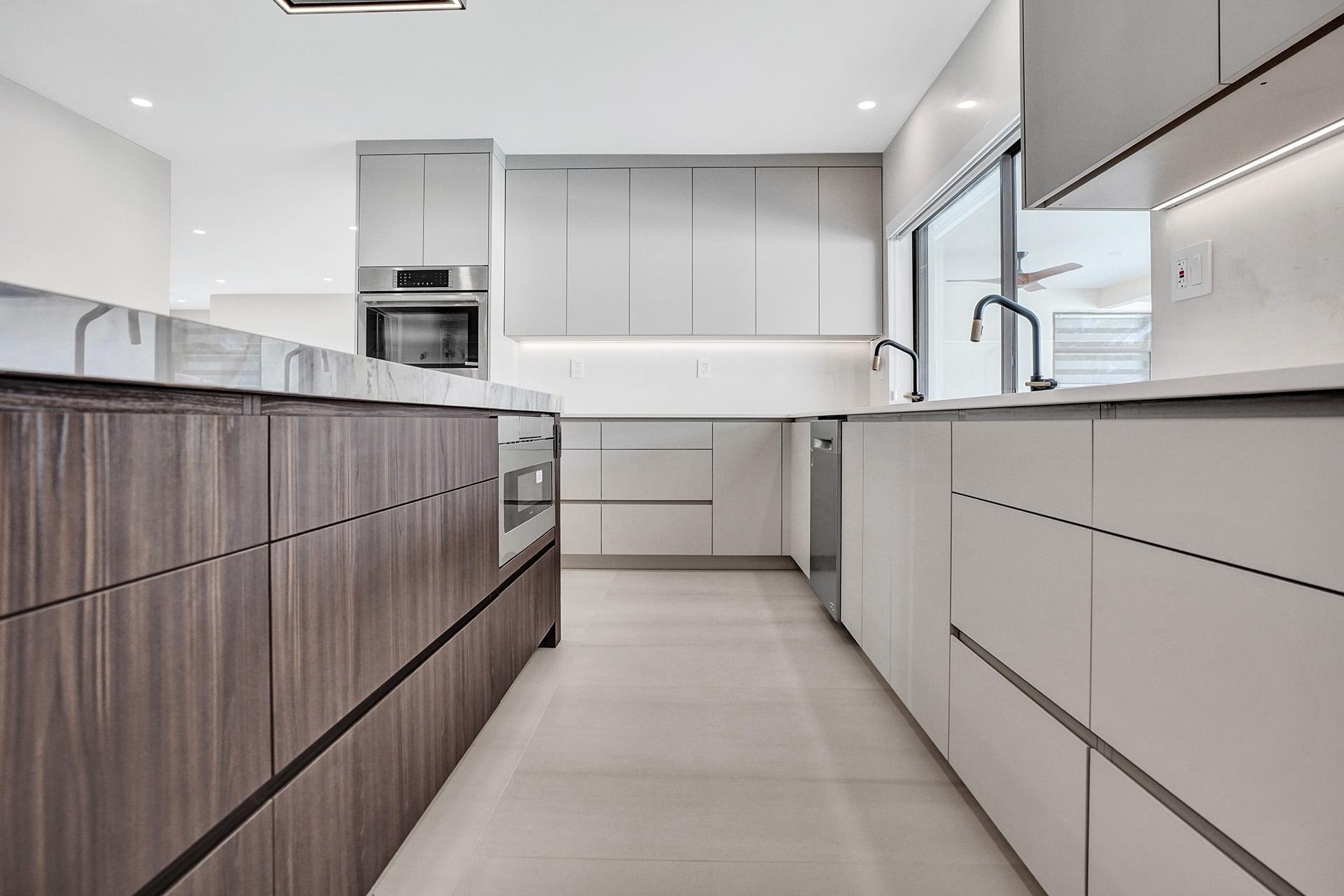 4951 Sarazen Drive Hollywood, FL 33021 - Photo 16 of 21 a kitchen with counter top space cabinets and stainless steel appliances