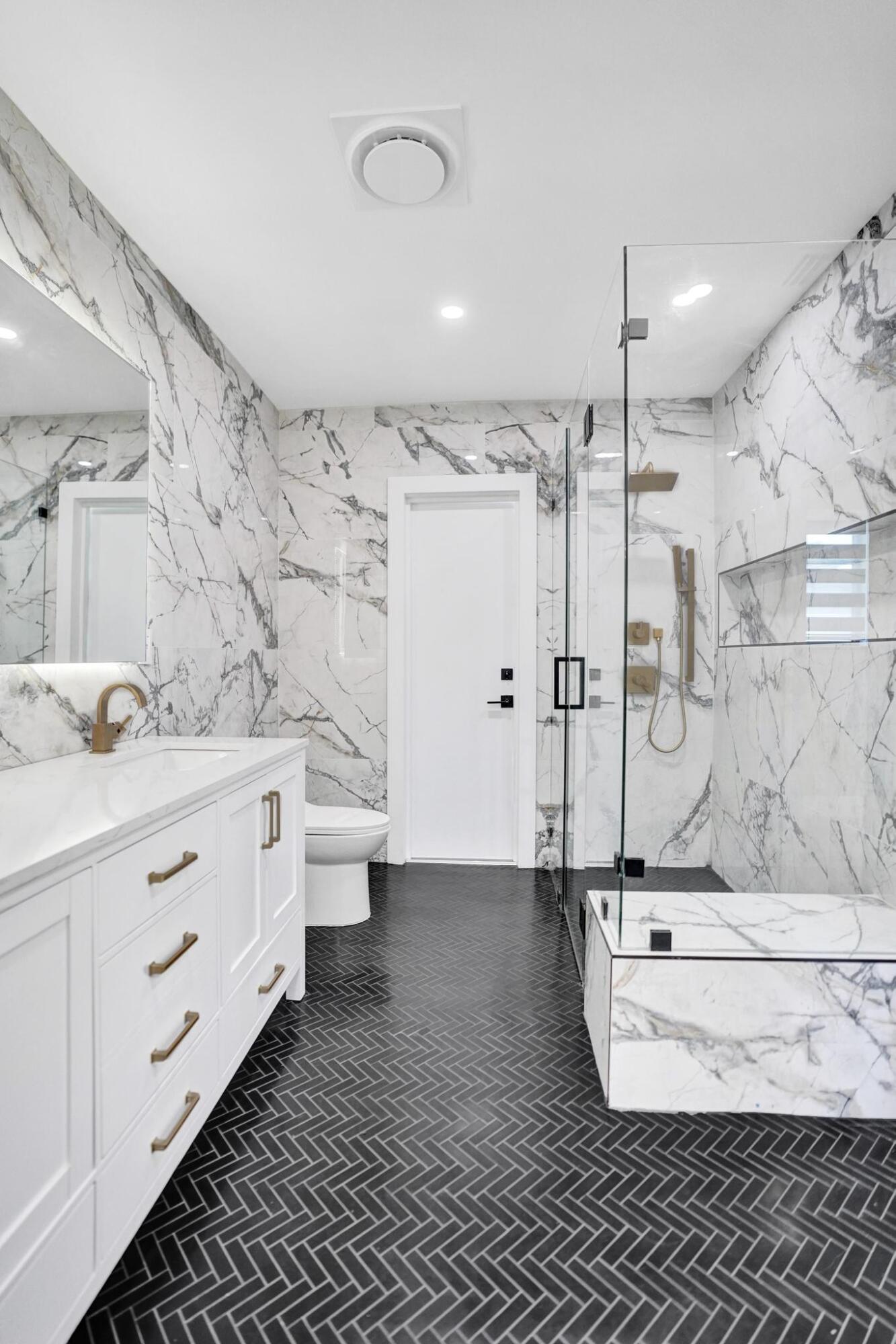 4951 Sarazen Drive Hollywood, FL 33021 - Photo 8 of 21 a bathroom with a double vanity sink toilet and shower