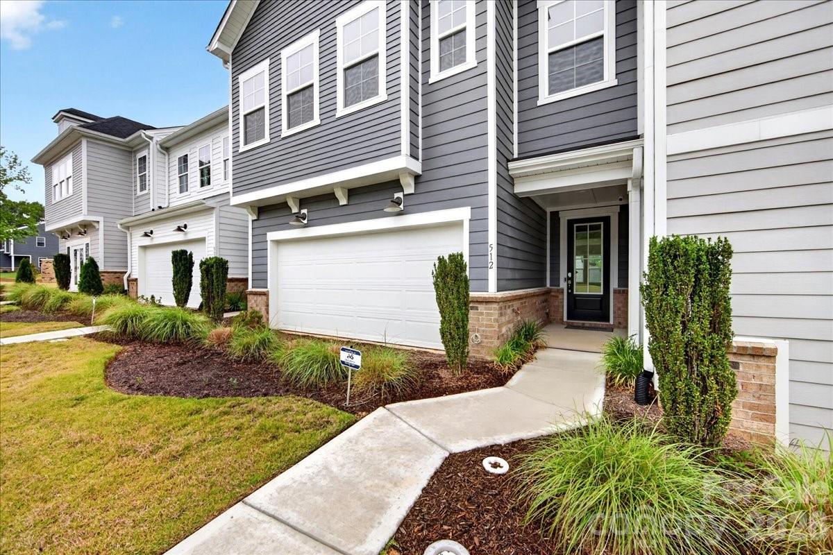 512 Webster Lane Cramerton, NC 28032 - Photo 2 of 28 a front view of a house with garden
