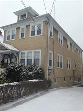 67 Fremont Street, Unit 1 Harrison, NY 10528 - Photo 1 of 1 a front view of a house with a garden