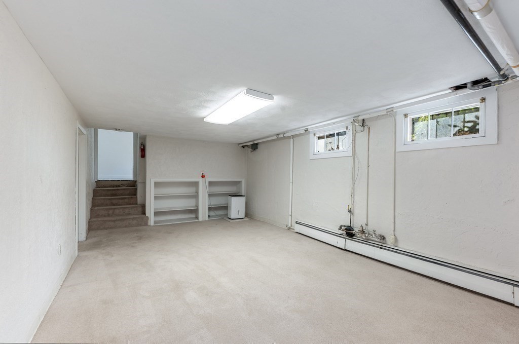 250 Hudson Road Sudbury, MA 01776 - Photo 12 of 19 an empty room with furniture and windows
