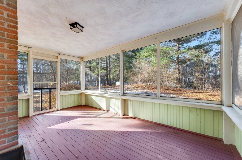 250 Hudson Road Sudbury, MA 01776 - Photo 14 of 19 a view of a kitchen with a large window and wooden floor