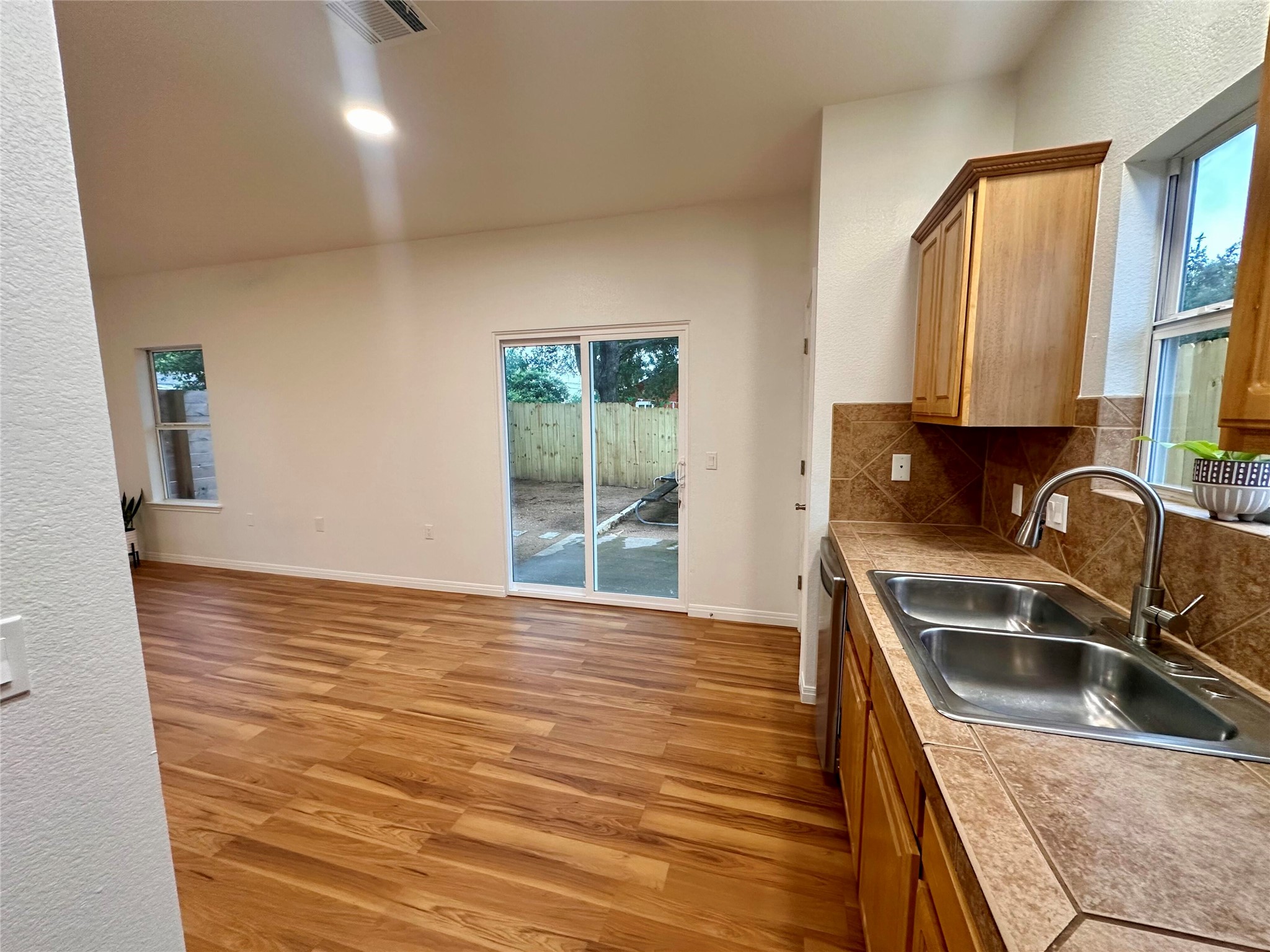 1122 Mansell Avenue Austin, TX 78721 - Photo 8 of 29 a kitchen with granite countertop a sink and a stove top oven