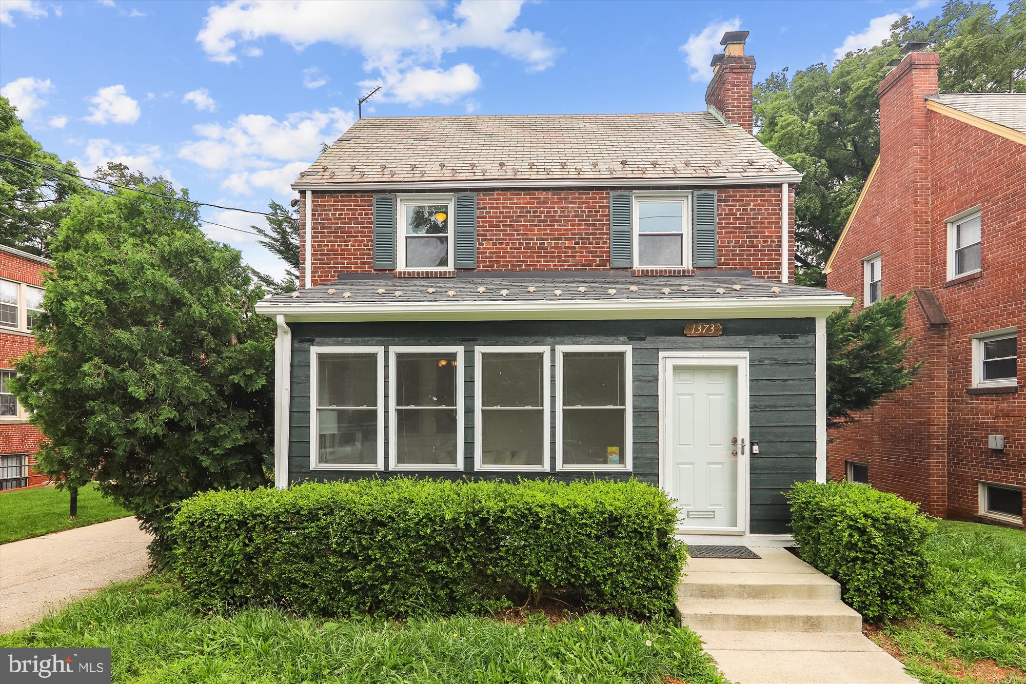 1373 Tuckerman Street Northwest Washington, DC 20011 - Photo 1 of 27 front view of a house with a yard