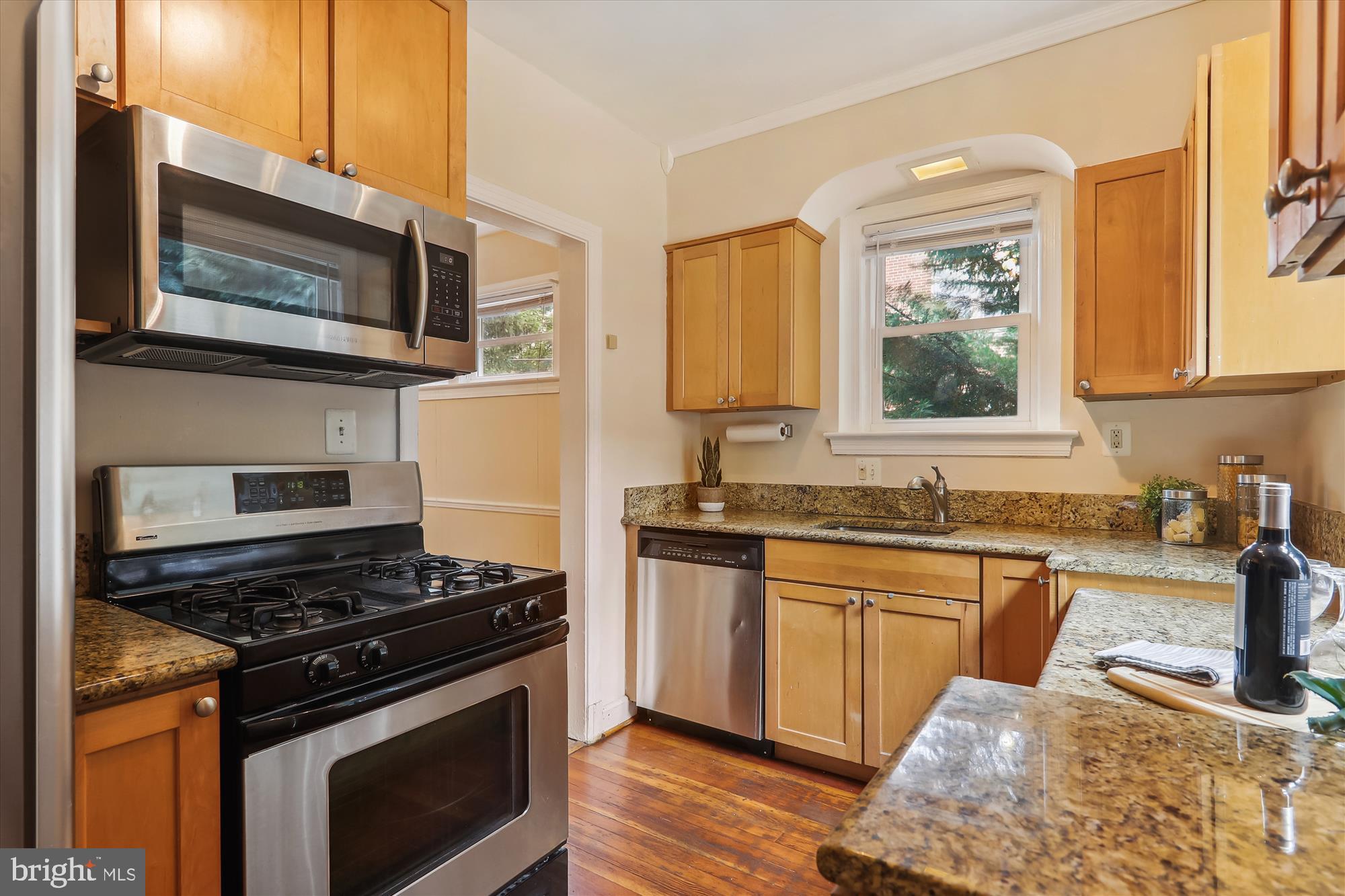 1373 Tuckerman Street Northwest Washington, DC 20011 - Photo 13 of 27 a kitchen with stainless steel appliances granite countertop a stove microwave and sink