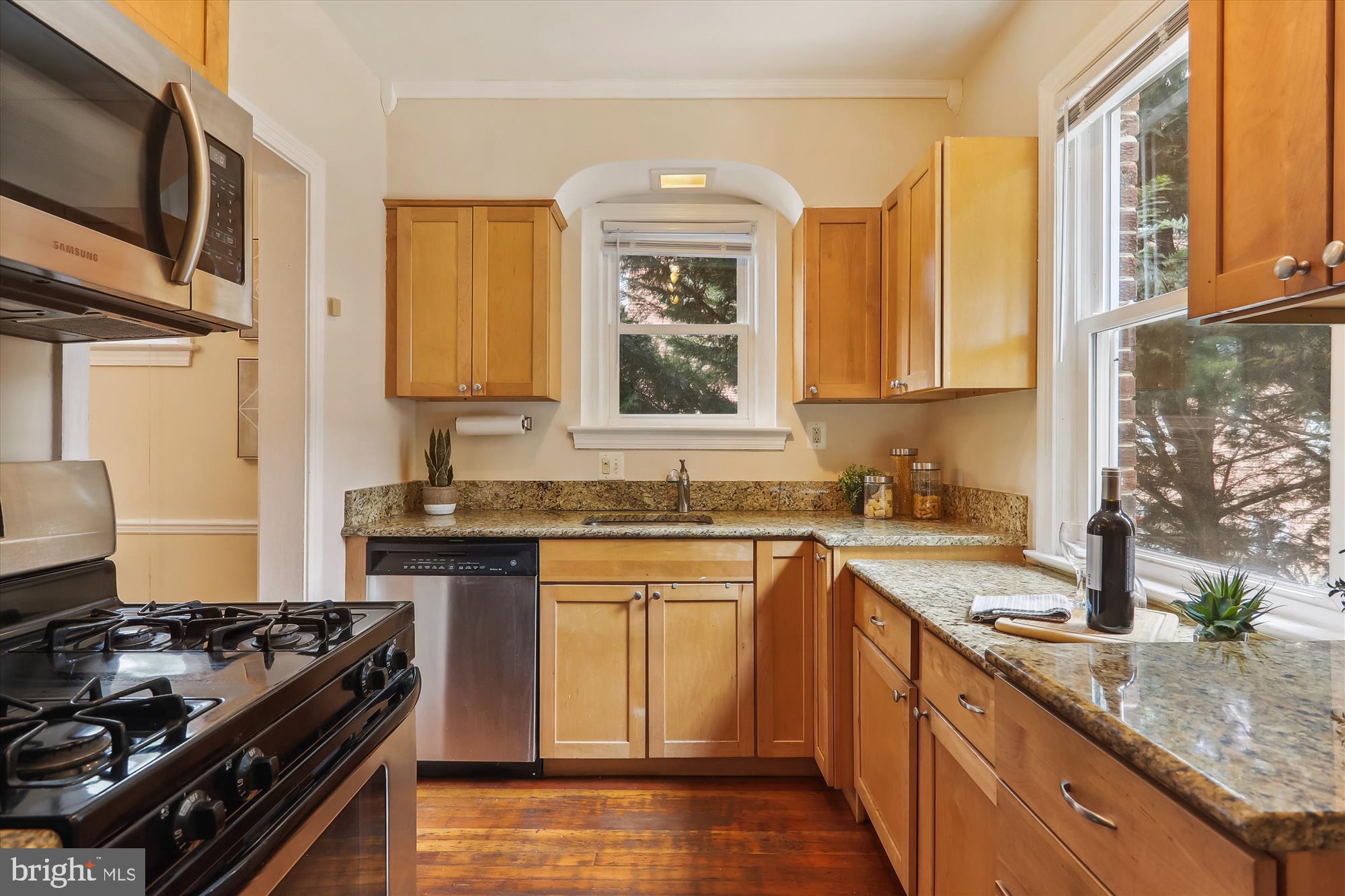 1373 Tuckerman Street Northwest Washington, DC 20011 - Photo 14 of 27 a kitchen with stainless steel appliances granite countertop a sink stove and refrigerator