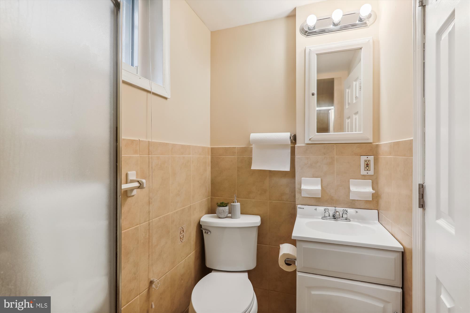 1373 Tuckerman Street Northwest Washington, DC 20011 - Photo 19 of 27 a bathroom with a toilet and a sink