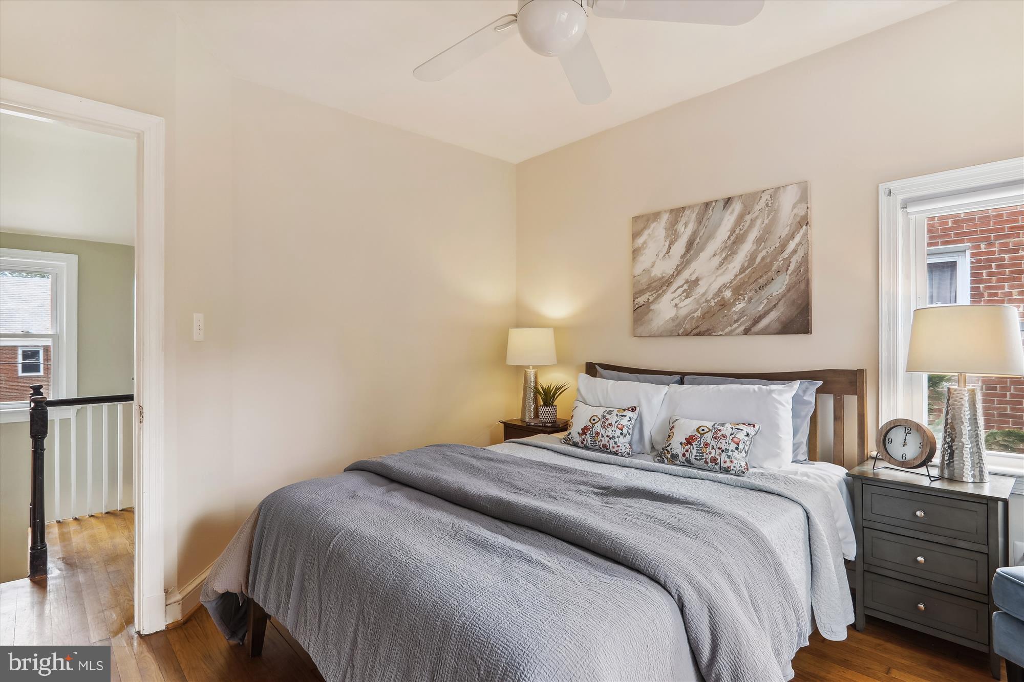 1373 Tuckerman Street Northwest Washington, DC 20011 - Photo 21 of 27 a bedroom with a bed and a painting on the wall
