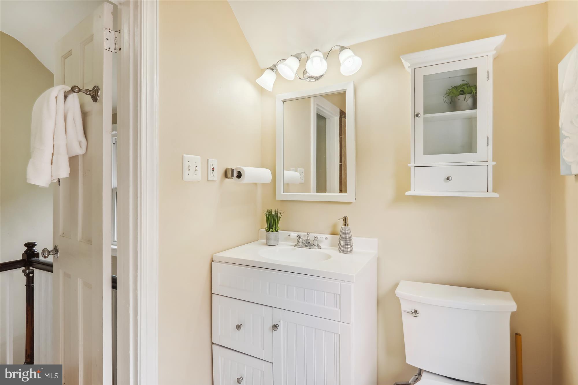 1373 Tuckerman Street Northwest Washington, DC 20011 - Photo 22 of 27 a bathroom with a sink vanity and mirror