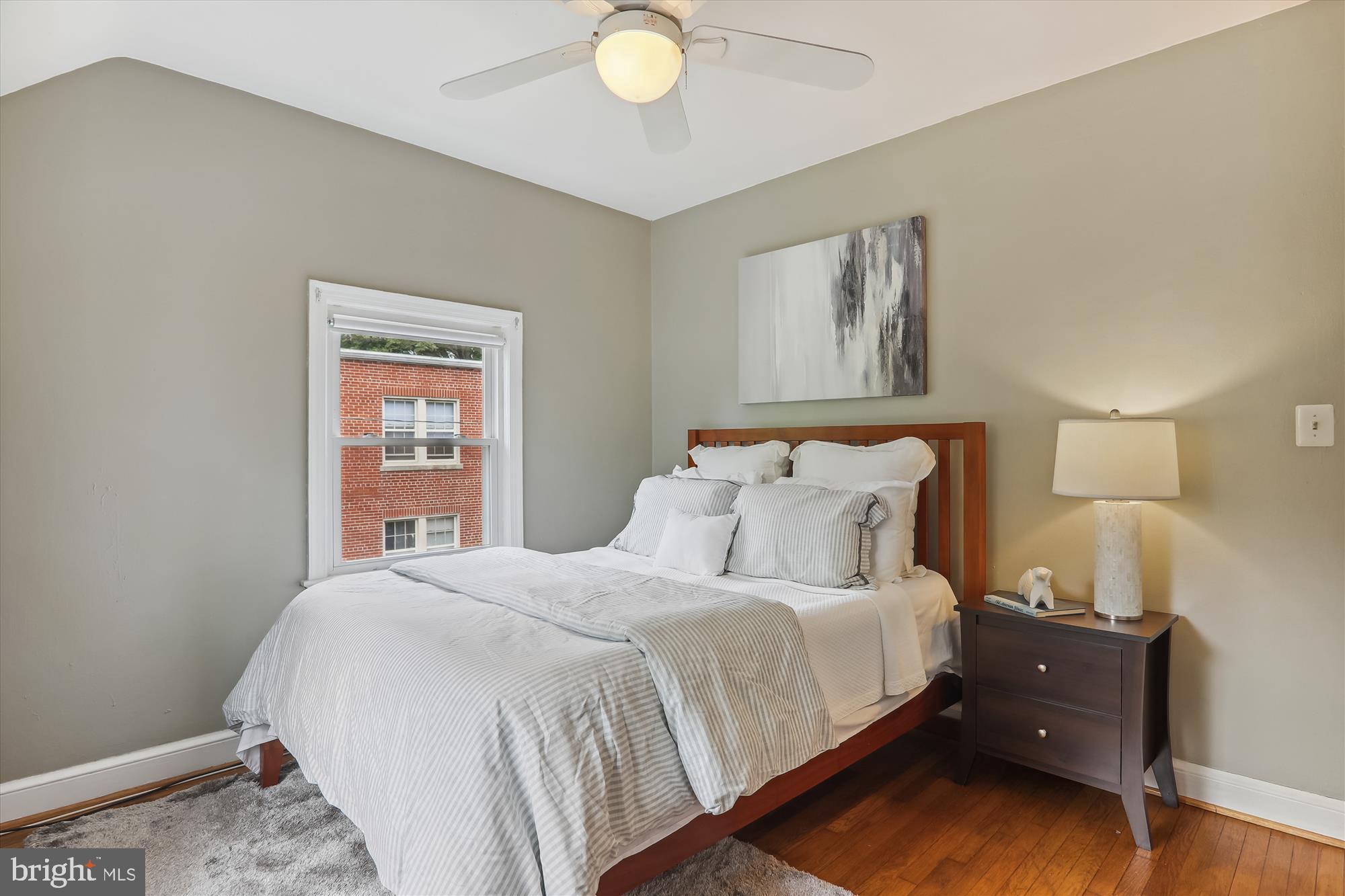 1373 Tuckerman Street Northwest Washington, DC 20011 - Photo 25 of 27 a bedroom with a bed and a window