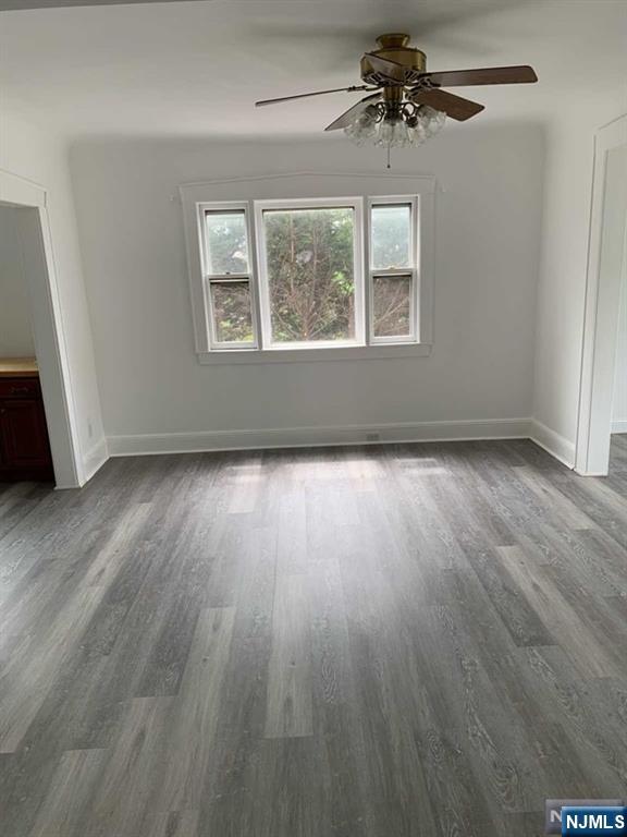 73 East Gouverneur Avenue Rutherford, NJ 07070 - Photo 10 of 33 a view of a big room with wooden floor chandelier and windows