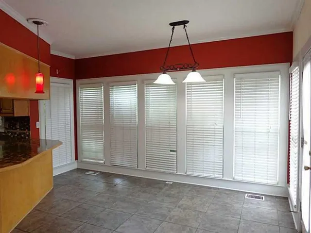 a kitchen that has a lot of cabinets
