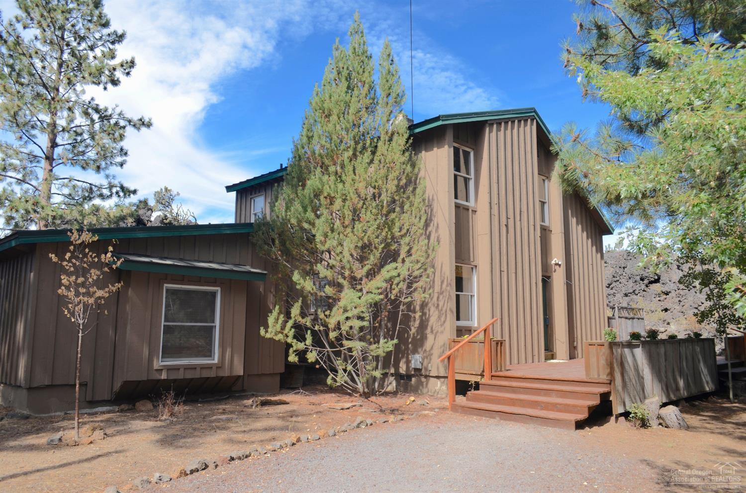60197 Turquoise Road Bend, OR 97702 - Photo 1 of 23 Front of house with deck