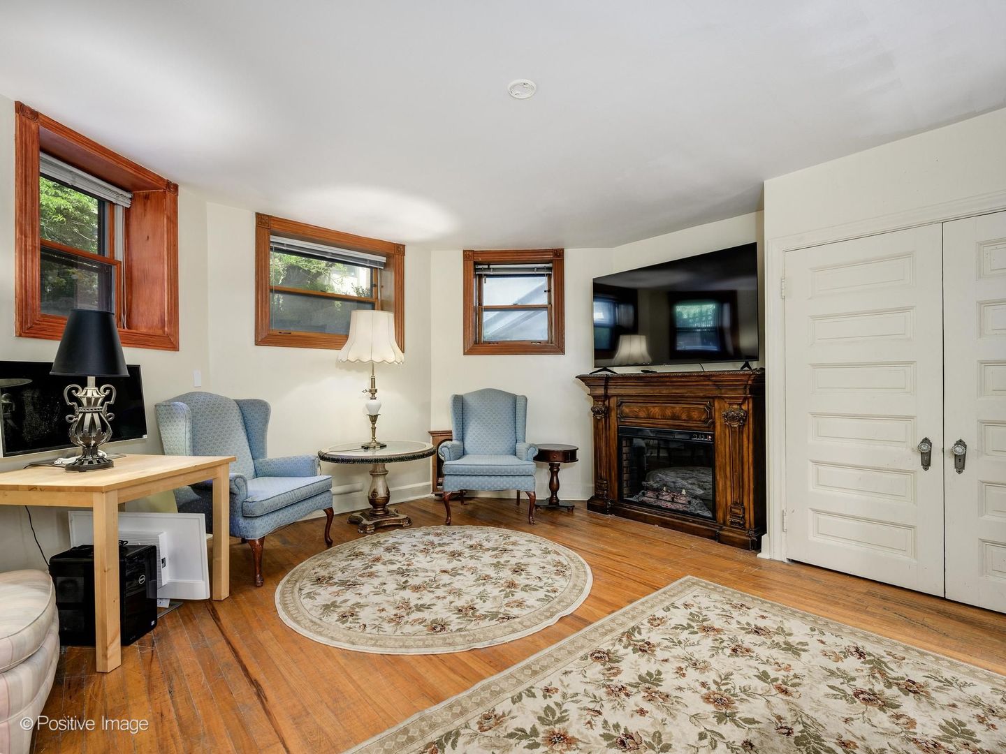 33 East Division Street Chicago, IL 60611 - Photo 28 of 34 a living room with furniture a fireplace and a flat screen tv