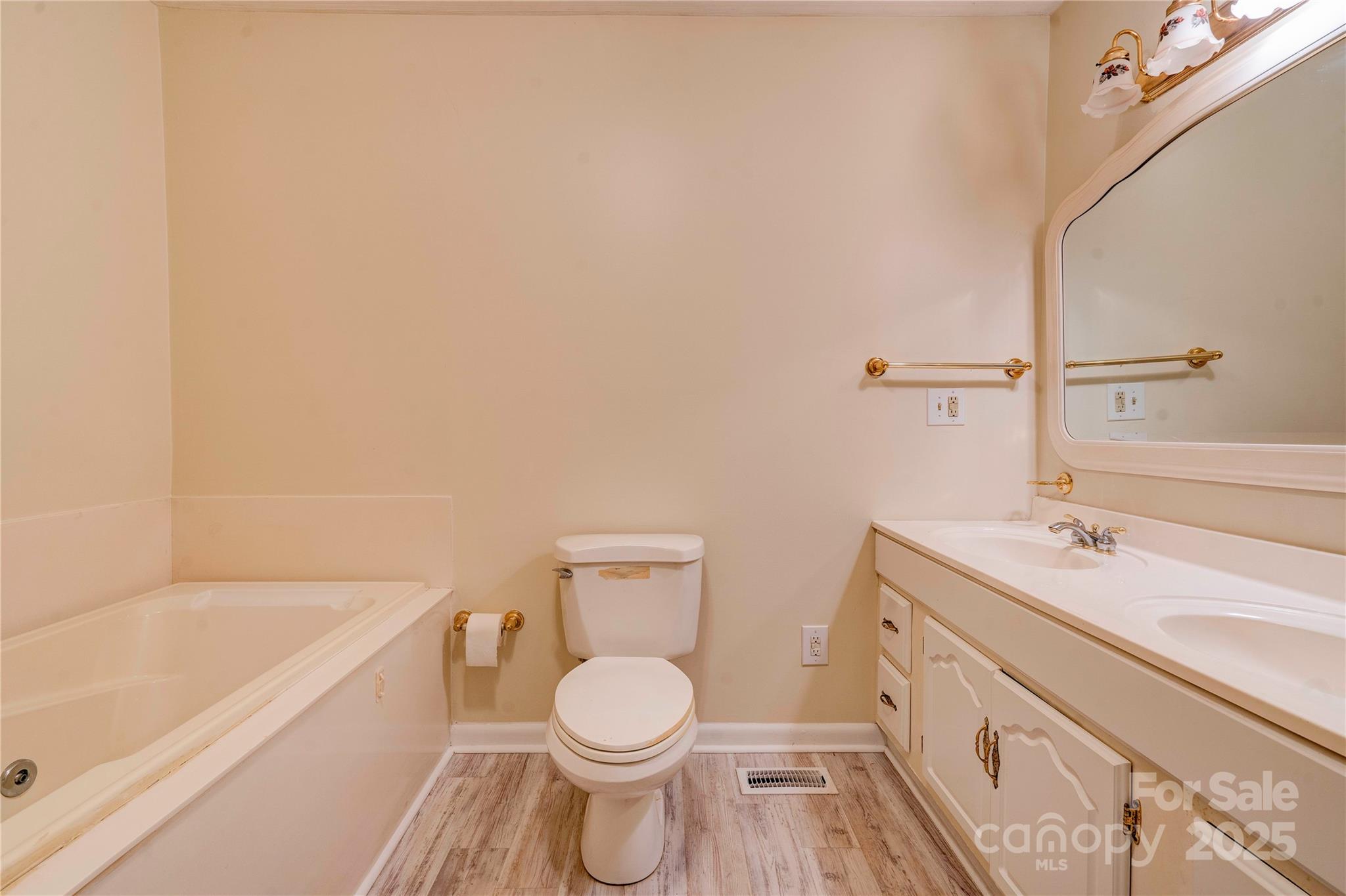 1602 Eaves Road Shelby, NC 28152 - Photo 13 of 19 a bathroom with a sink a toilet and bathtub