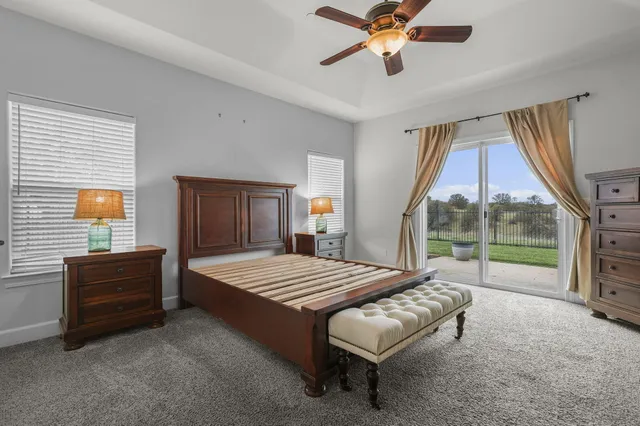 a white toilet sitting next to a window
