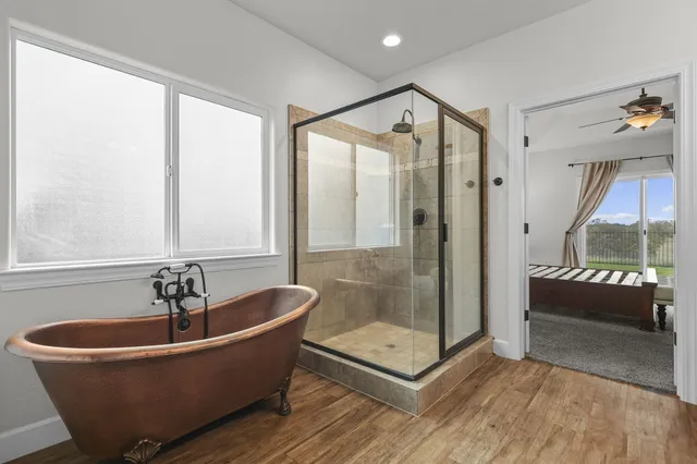 a view of room with a ceiling fan and a window