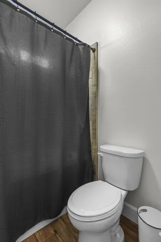 a view of a backyard with table and chairs under an umbrella
