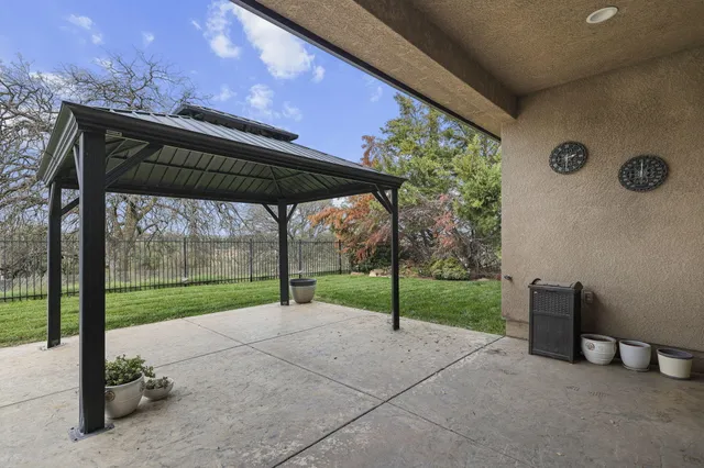 a view of yard with outdoor seating and lake