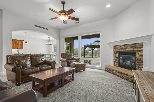 a bathroom with a granite countertop sink mirror and cabinets