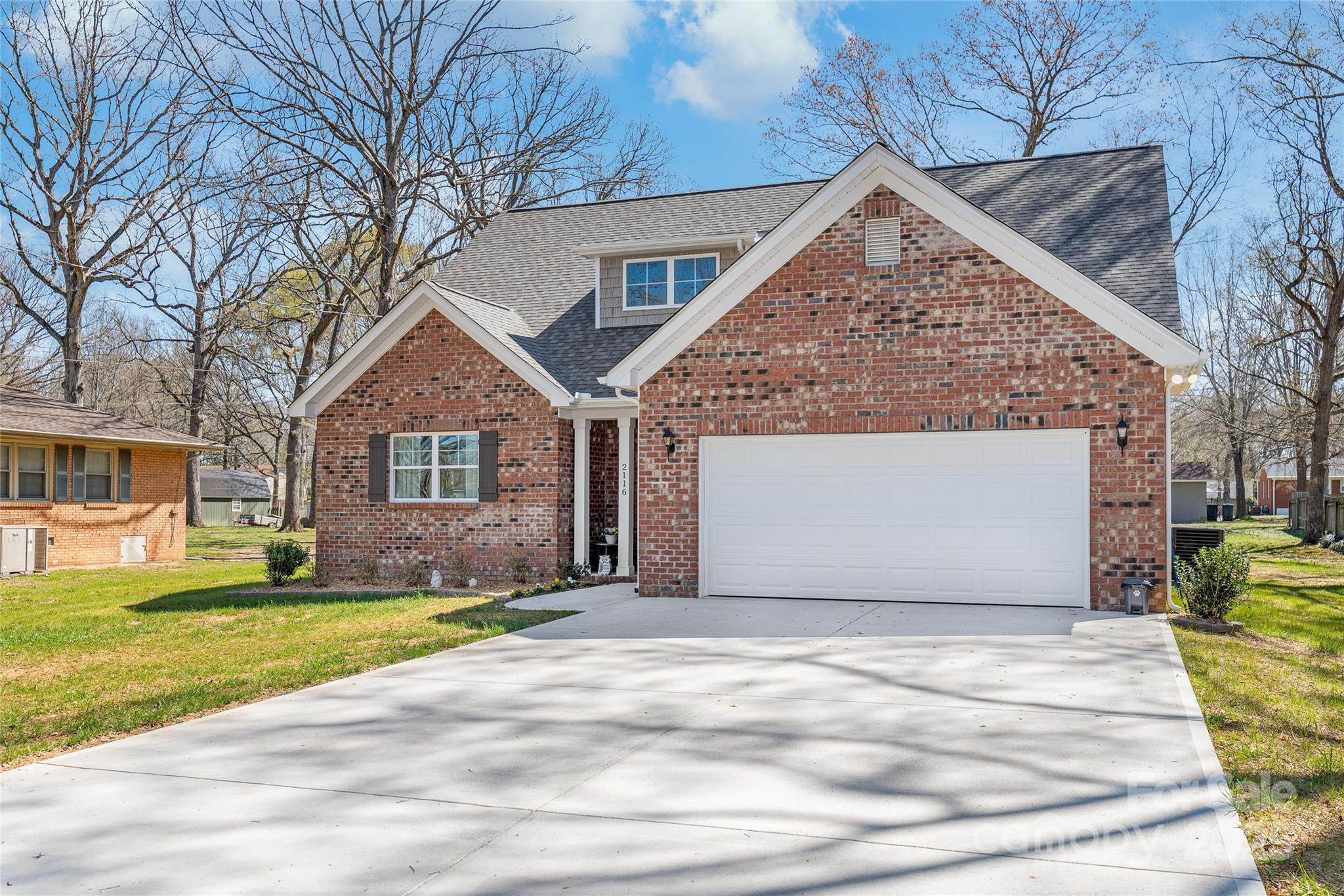 2116 Wilson Avenue Monroe, NC 28110 - Photo 2 of 21 a front view of a house with a yard and garage