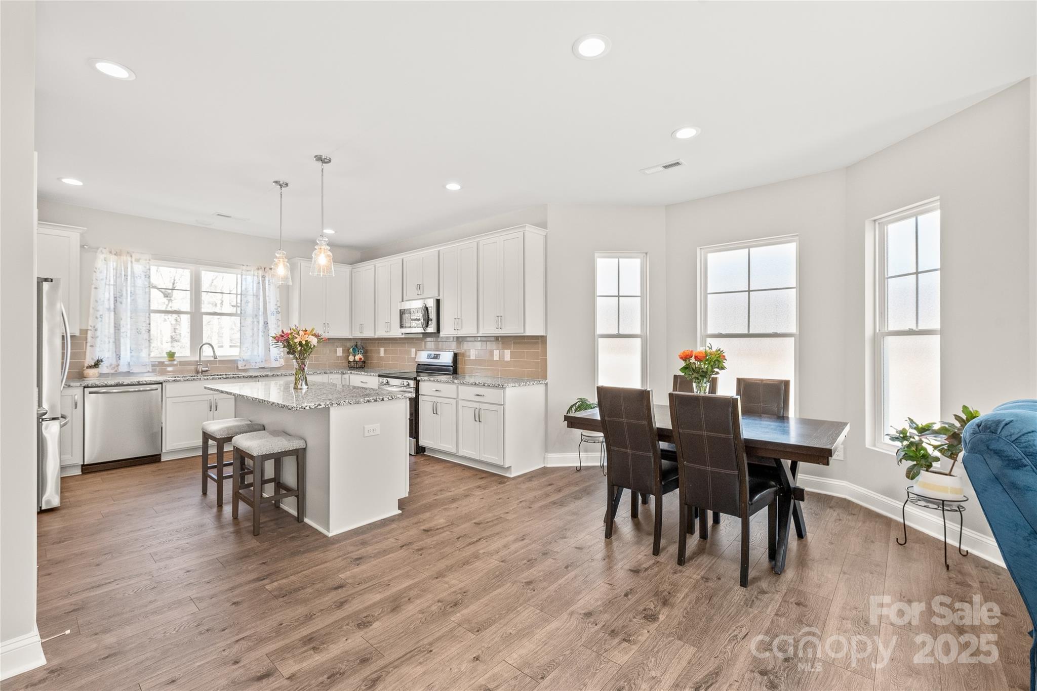 2116 Wilson Avenue Monroe, NC 28110 - Photo 7 of 21 a view of kitchen with cabinets table and chairs
