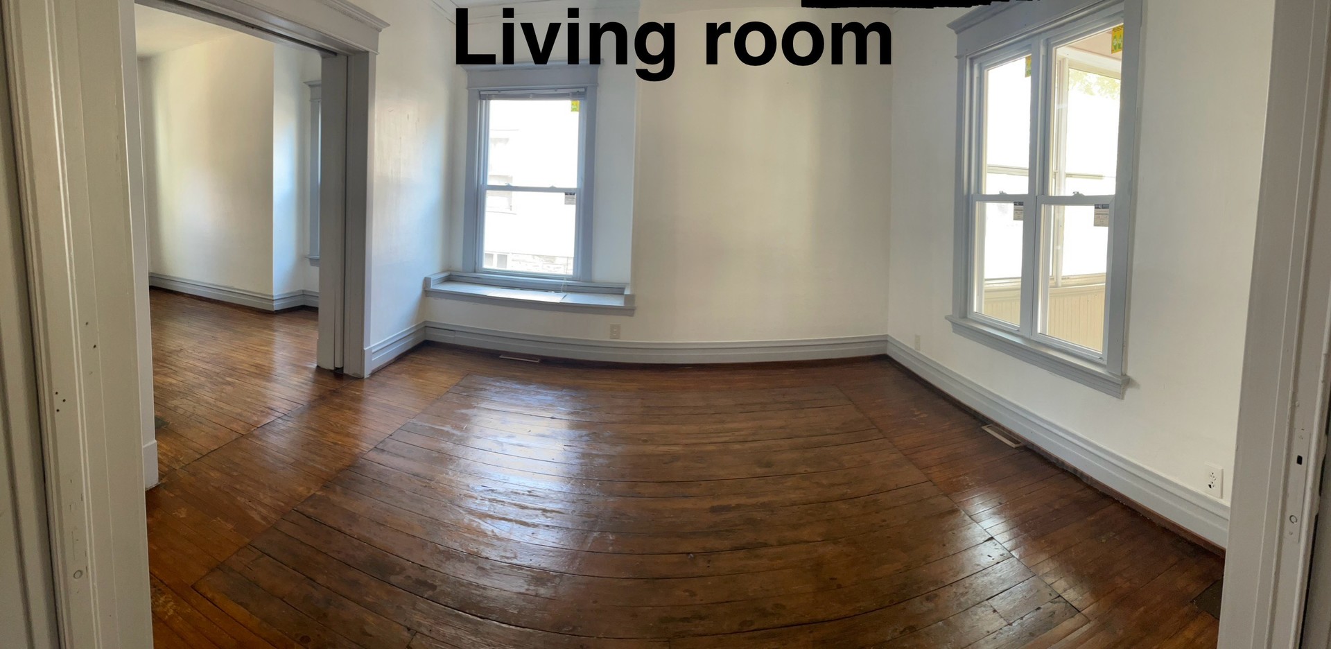 136 John Street DeKalb, IL 60115 - Photo 18 of 19 an empty room with wooden floor and windows