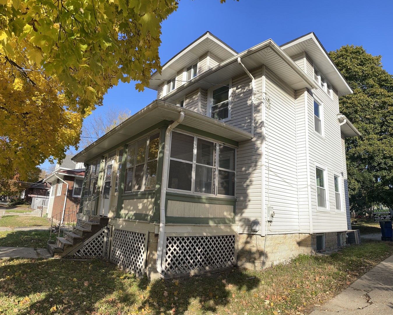 136 John Street DeKalb, IL 60115 - Photo 3 of 19 a front view of a house with a garage