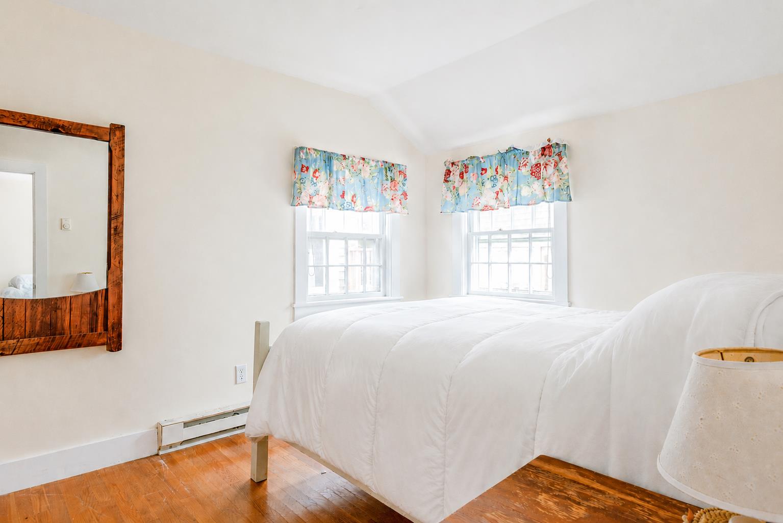 12 King Street Nantucket, MA 02554 - Photo 28 of 32 a bed sitting in a bedroom next to a window